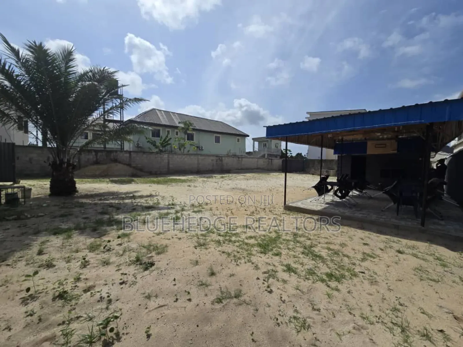 Fully Fenced Commercial Land With Gate and a Structure