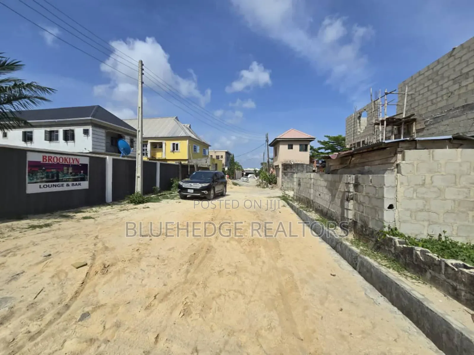 Fully Fenced Commercial Land With Gate and a Structure