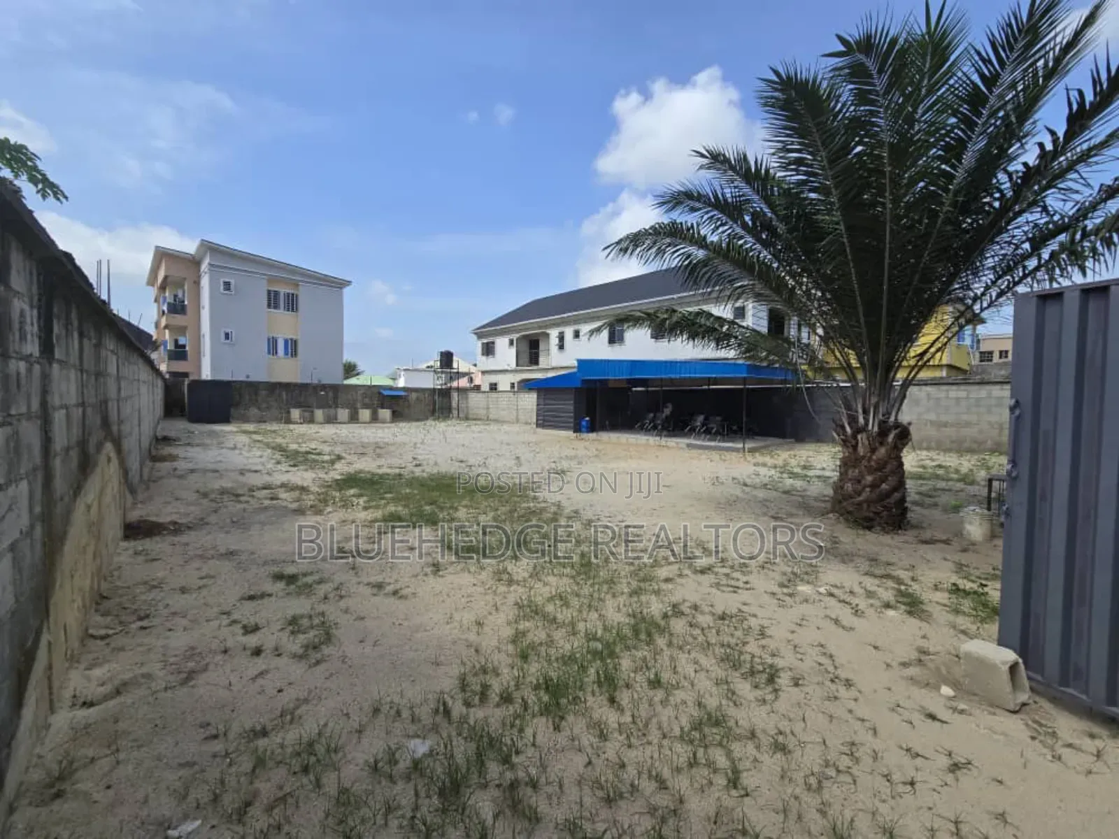 Fully Fenced Commercial Land With Gate and a Structure