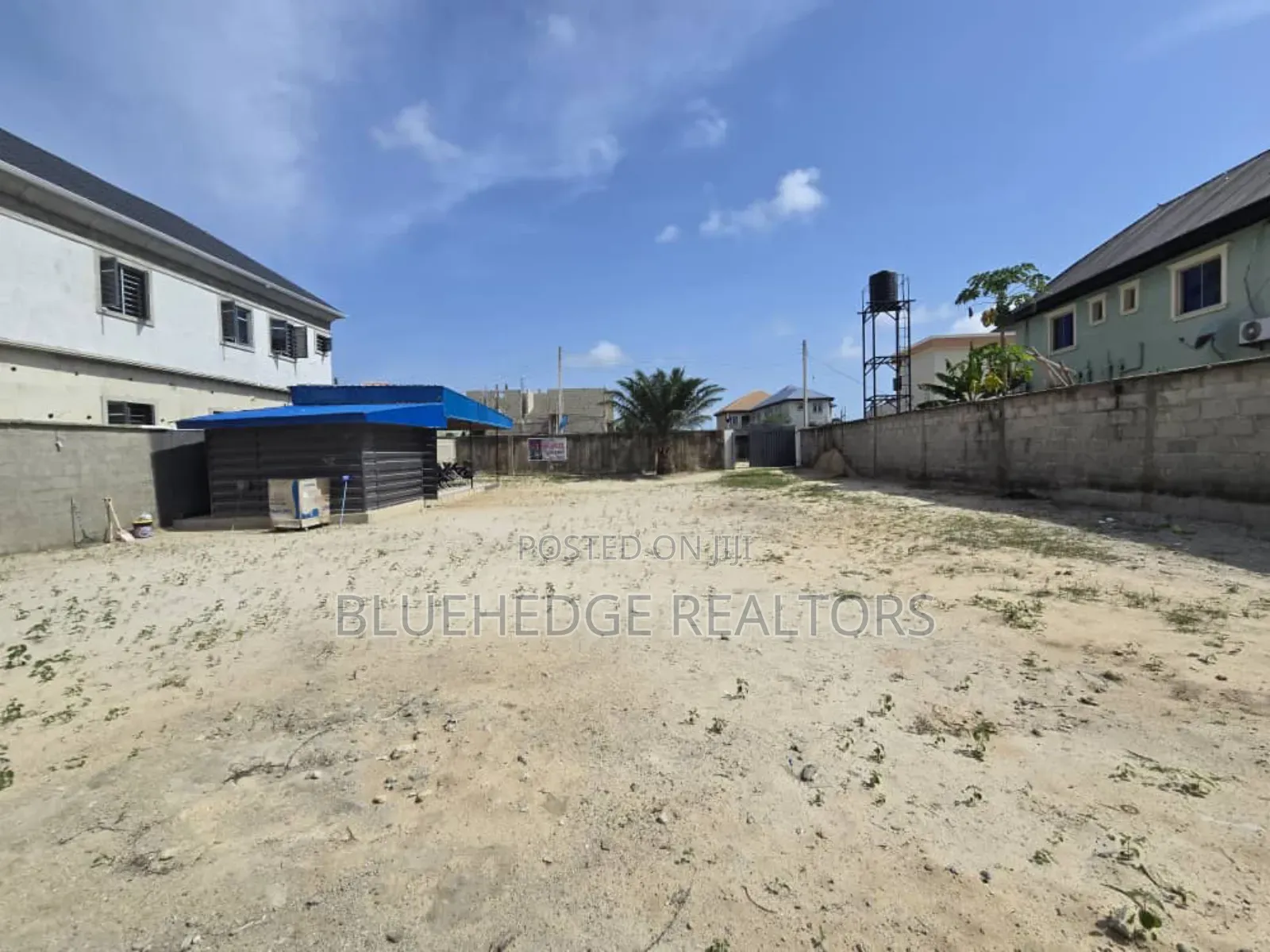 Fully Fenced Commercial Land With Gate and a Structure